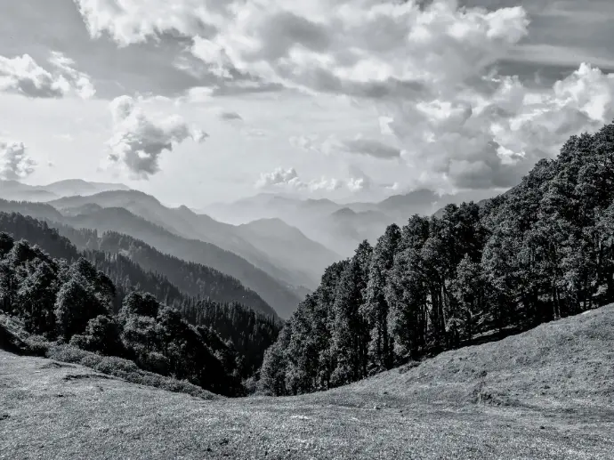 snow covered mountain under cloudy sky during daytime